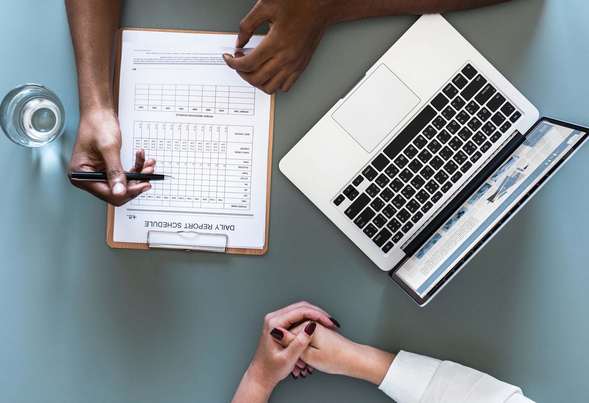 Overhead image of an interviewer filling out an interview form