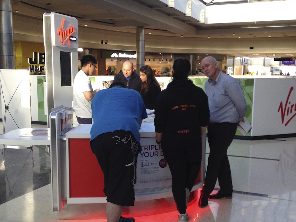 Service designers interview customers at a Virgin mobile retail store outlet