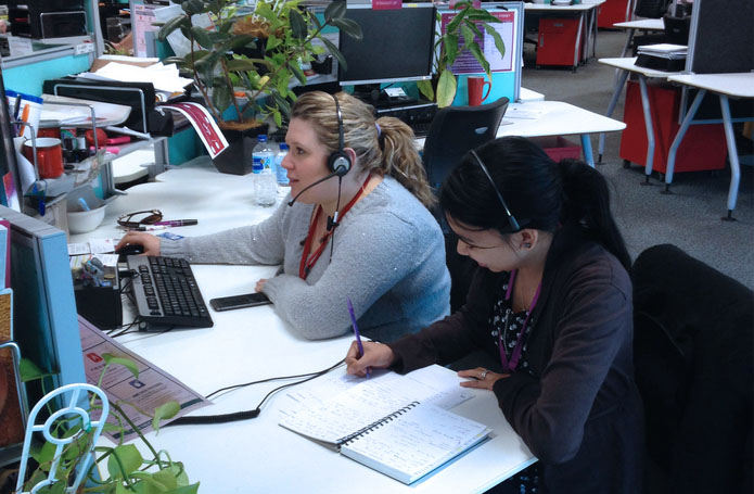 Virgin Mobile staff member being shadowed by Proto researcher during customer calls