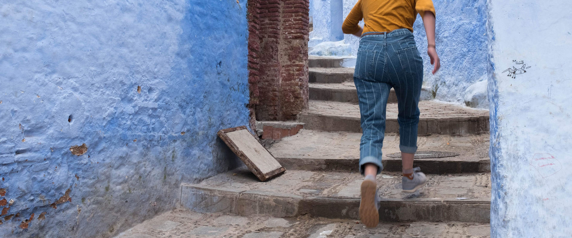 Woman running up stairs representing running away from competition