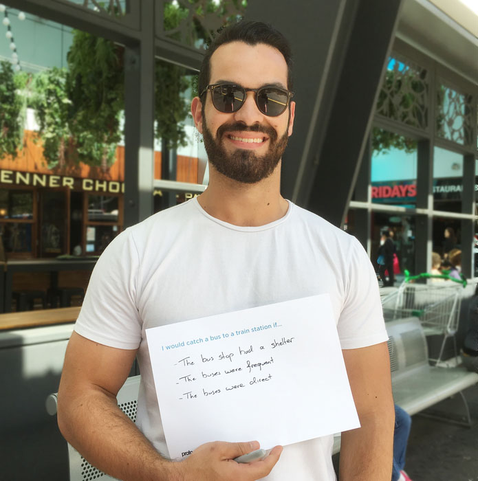 Sydney Metro customer presenting ideas card to Proto during immersive research