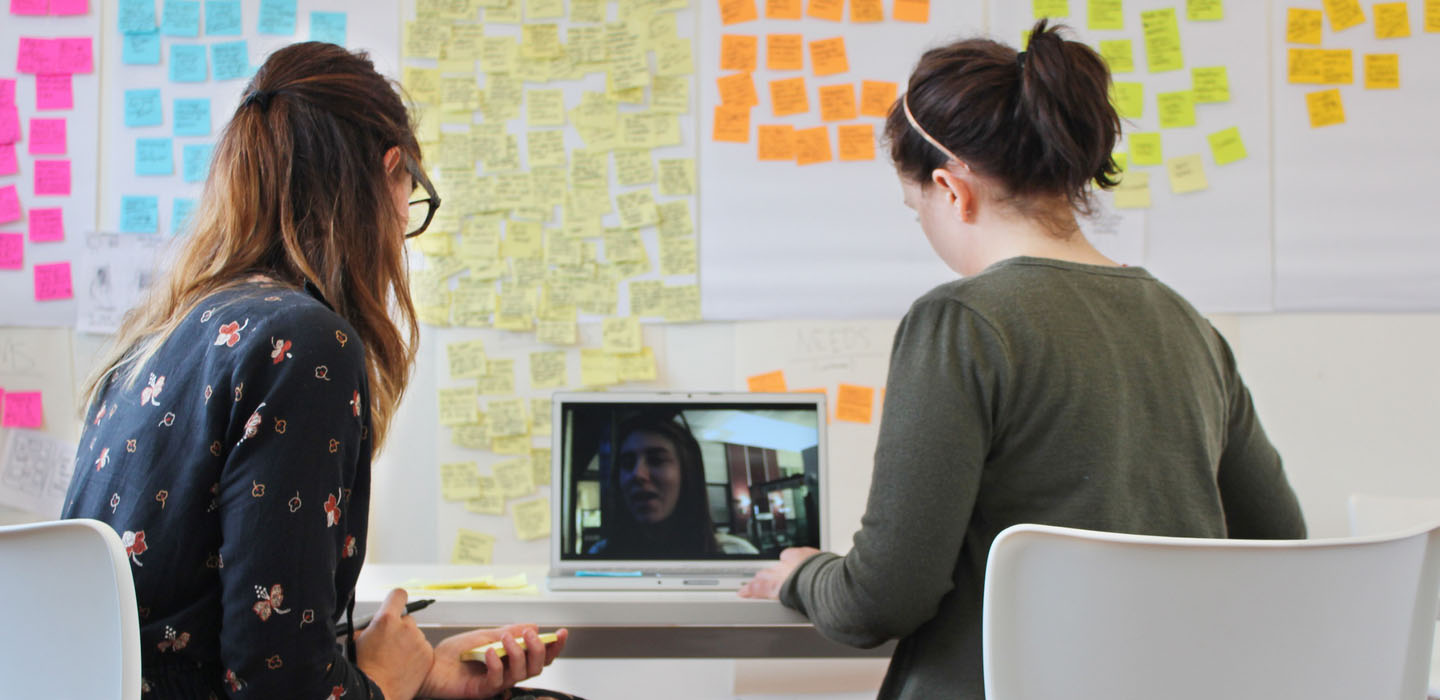 Two Proto Customer experience designers conducting a video meeting